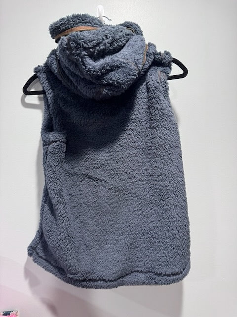 A plush, fuzzy hooded sleeveless vest.